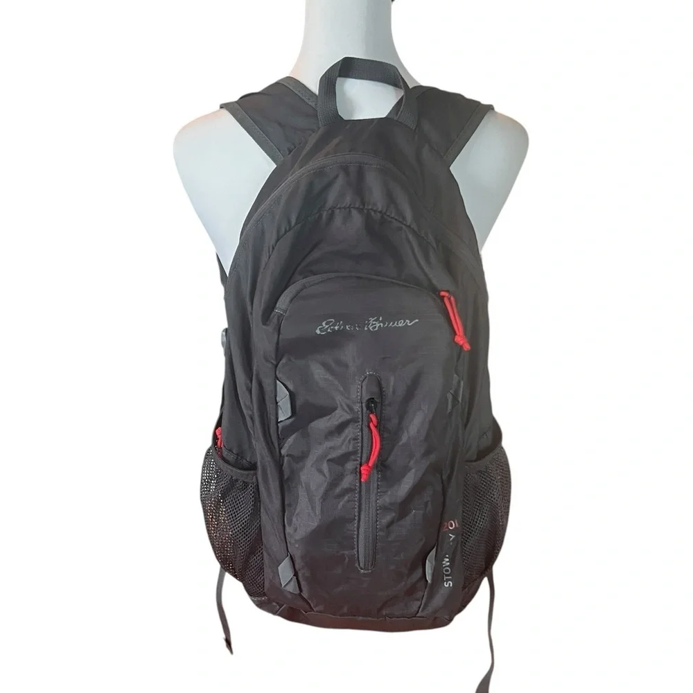 EDDIE BAUER STOWAWAY PACKABLE 20L BACKPACK in black with red piping